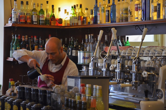 A Barista offering Italian ice cream and coffee in the Gelateria Pepino 